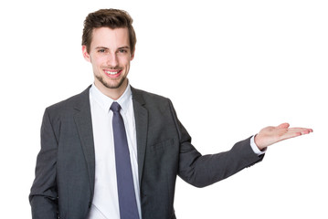 Businessman with hand promote something