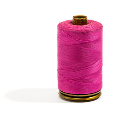 Close up Dark Pink Cotton Thread on a Reel