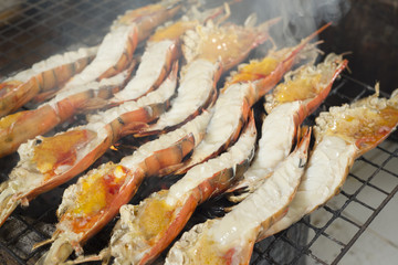 Grilled giant river prawn on bbq stove.