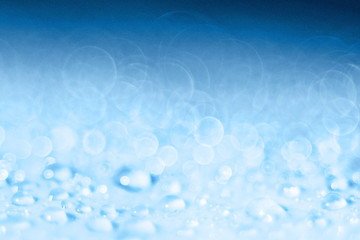Blue light blurred background texture bokeh drops