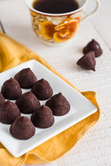 truffle chocolates with a cup of coffee and cream