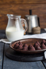 truffle chocolates with a cup of coffee and cream