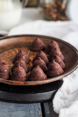 truffle chocolates with a cup of coffee and cream