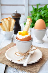 boiled egg for breakfast on a wooden table