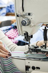 Industrial sewing machines with sewing machine operator