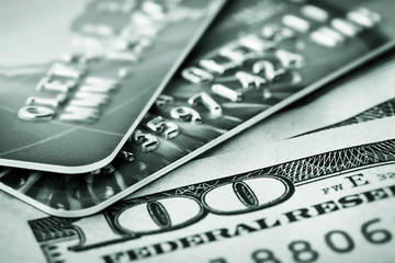 Background of hundred-dollar bills and credit cards