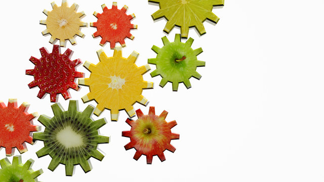 Gears made of fruit slices on white background