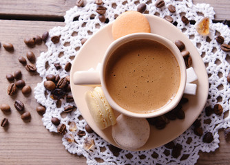 Gentle colorful macaroons and  coffee in mug