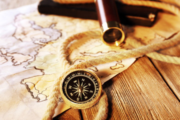 Marine still life spyglass and world map on wooden background