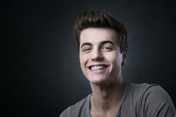 Fototapeta premium Smiling handsome young man posing