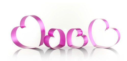 Purple hearts from ribbon isolated on white