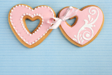 Heart shaped cookies for valentines day on color background
