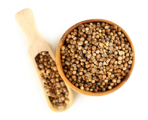 Coriander in wooden bowl, isolated on white