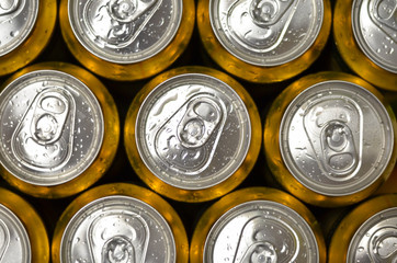 Abstract vie of cold cans with refreshing drink background