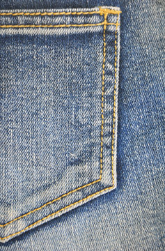 fragment of jeans pocket, closeup.