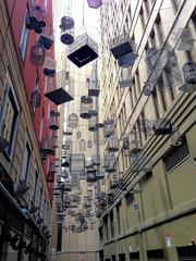 Many Hanging Cage Between Buildings