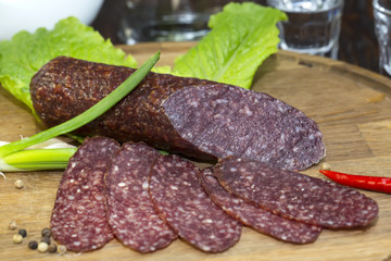 sausage on a wooden plate in a restaurant