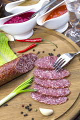 sausage on a wooden plate in a restaurant