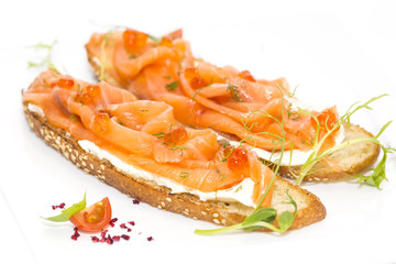 sandwiches with salmon caviar and greens adorned