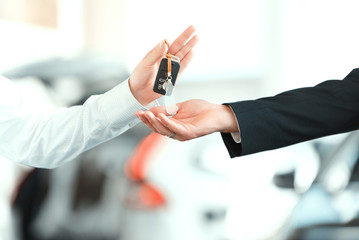 Handsome young man in dealership