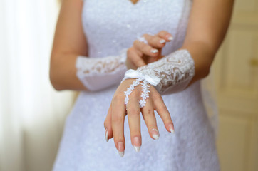 hand of fiancee in a glove