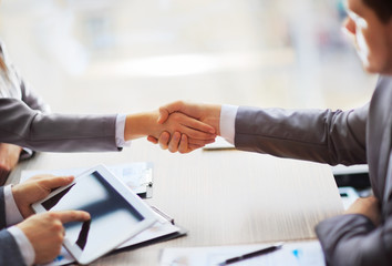 people shaking hands, finishing up a meeting