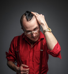 Male in red t shirt in studio.