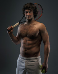 Male tennis player with racket.