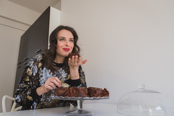 Beautiful young brunette posing with brownies