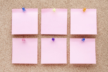 blank notes and multicolored thumbtacks