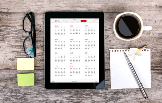 digital tabletdigital tablet as a calendar  and coffee cup wit
