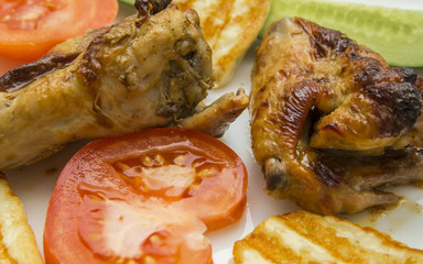 fried chicken wings in Thai with fresh tomatoes