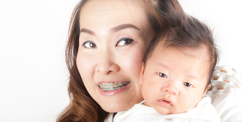 young asian mother and baby in the room