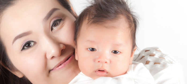 young asian mother and baby in the room