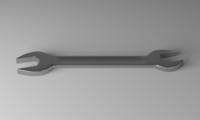 Steel wrench on gray