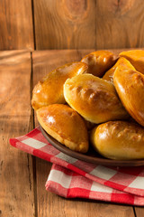 tasty pastry on plate at wood