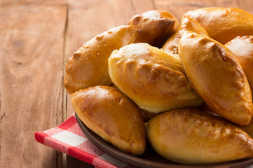 tasty pastry on plate at wood