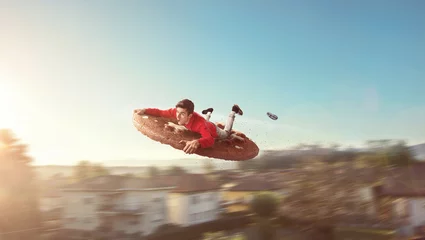 Zelfklevend Fotobehang Flying guy on a giant biscuit © frenky362
