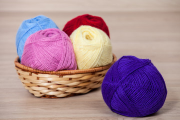 Fototapeta na wymiar Skeins of yarn in a braided basket