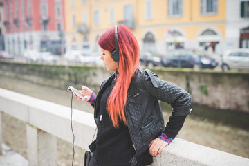 young beautiful red hair venezuelan woman lifestyle listening mu