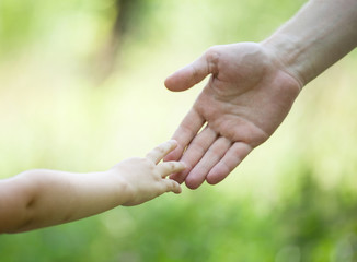 Child's and gather's hands holding together