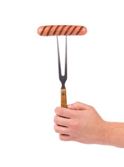 Grilled sausage on a fork.