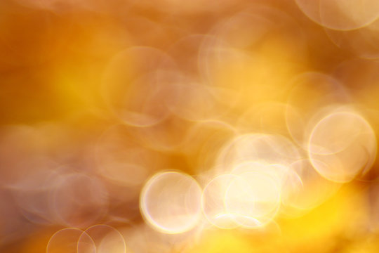 golden orange autumn background blur bokeh, defocusing lens