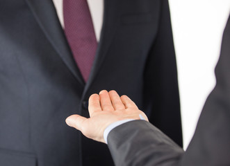 Businessman with open hand - closeup shot