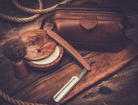 Shaving accessories on a luxury wooden background
