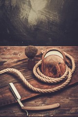 Shaving accessories on a luxury wooden background