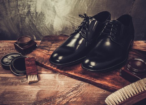 Shoe care accessories on a wooden table