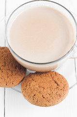 oatmeal cookie with coffee wooden white background