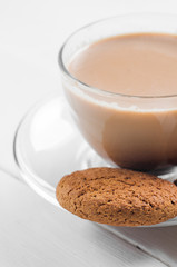 oatmeal cookie with coffee wooden white background