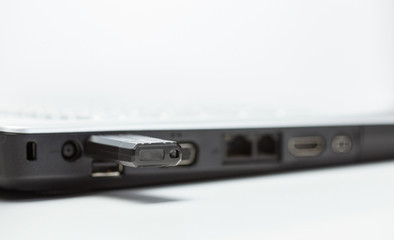 Laptop and removable usb memory - closeup shot